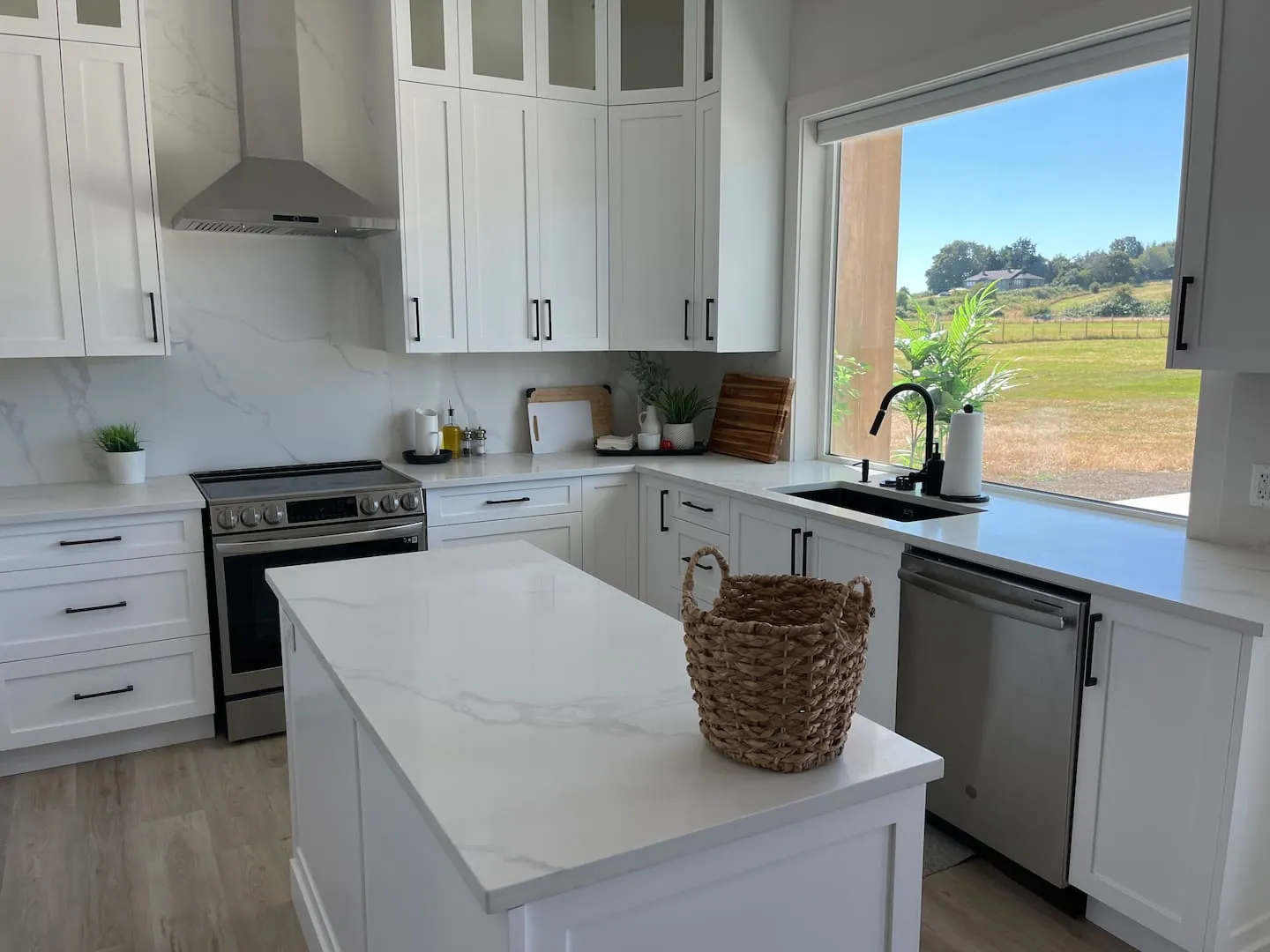 The Suite's kitchen at New Bright Modern Farm Oasis, with the farm fields through the window